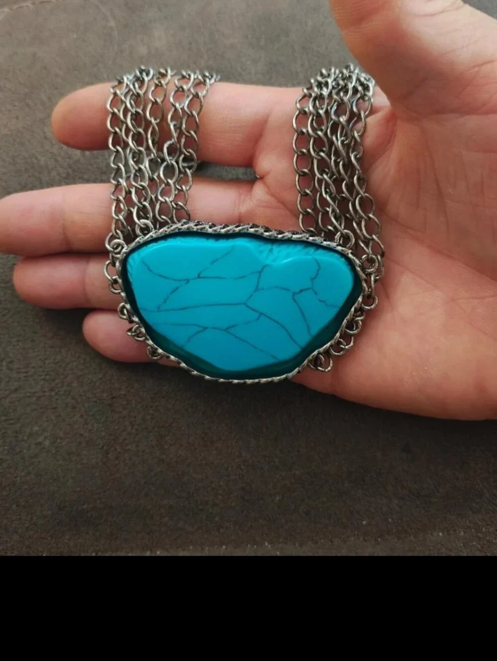Silver Tone Multi Strand Chain Statement Necklace With a Faux Turquoise Stone